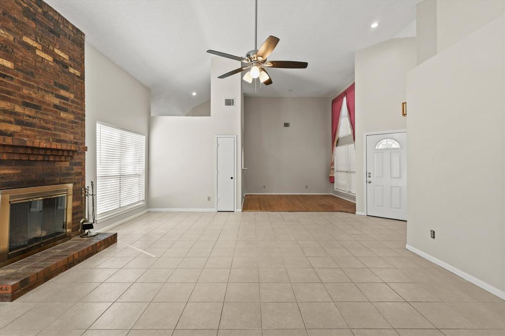 1113 Kit Lane Plano, TX 75023 - Photo 6 of 31 a view of an empty room with a fireplace