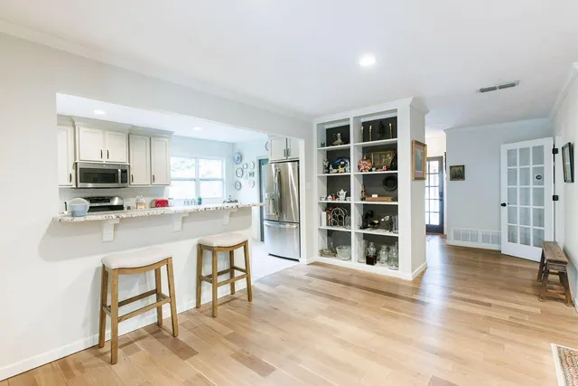 a kitchen with a white cabinets and white appliances