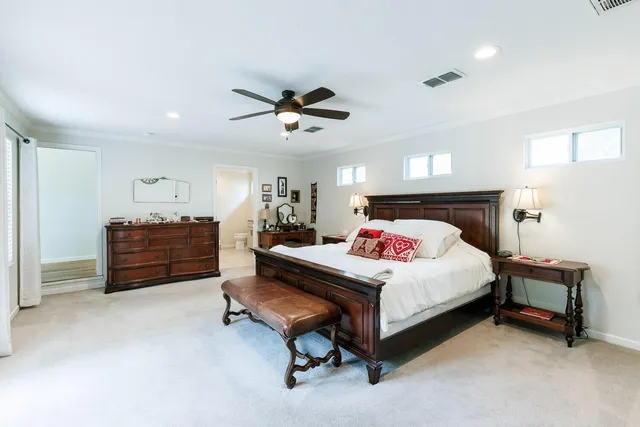 a bedroom with bed and window