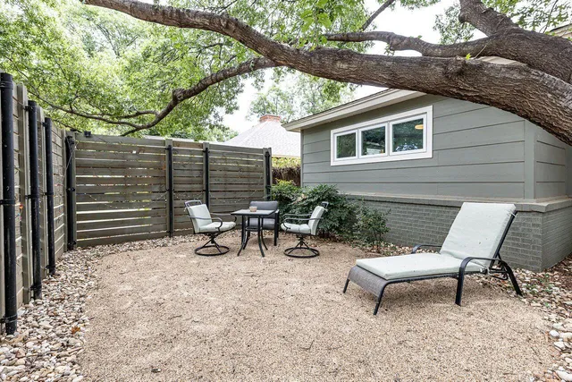 a view of a bench in the backyard