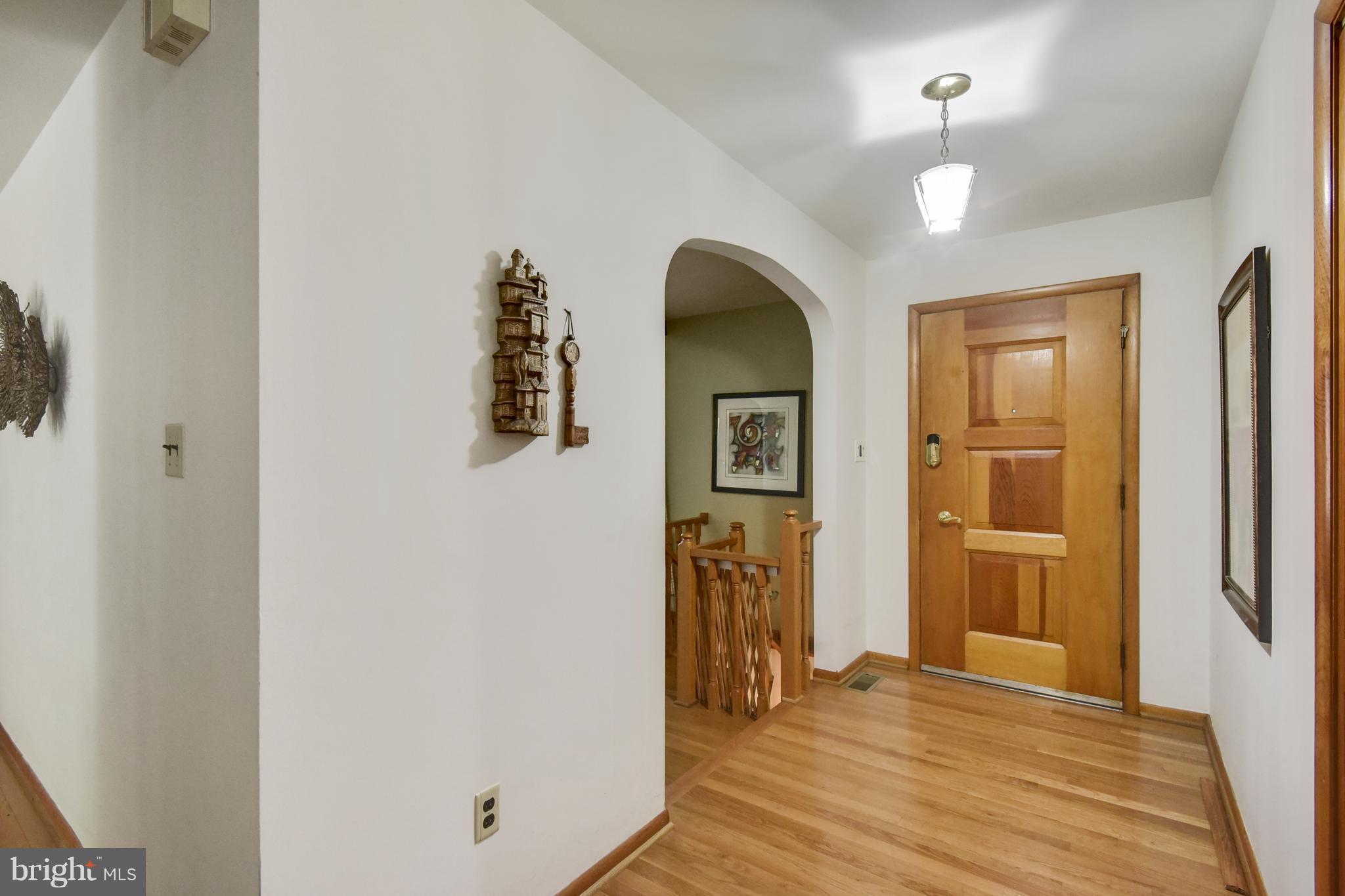 2045 Fridinger Mill Road Westminster, MD 21157 - Photo 4 of 30 Foyer with custom door and hardwood floor