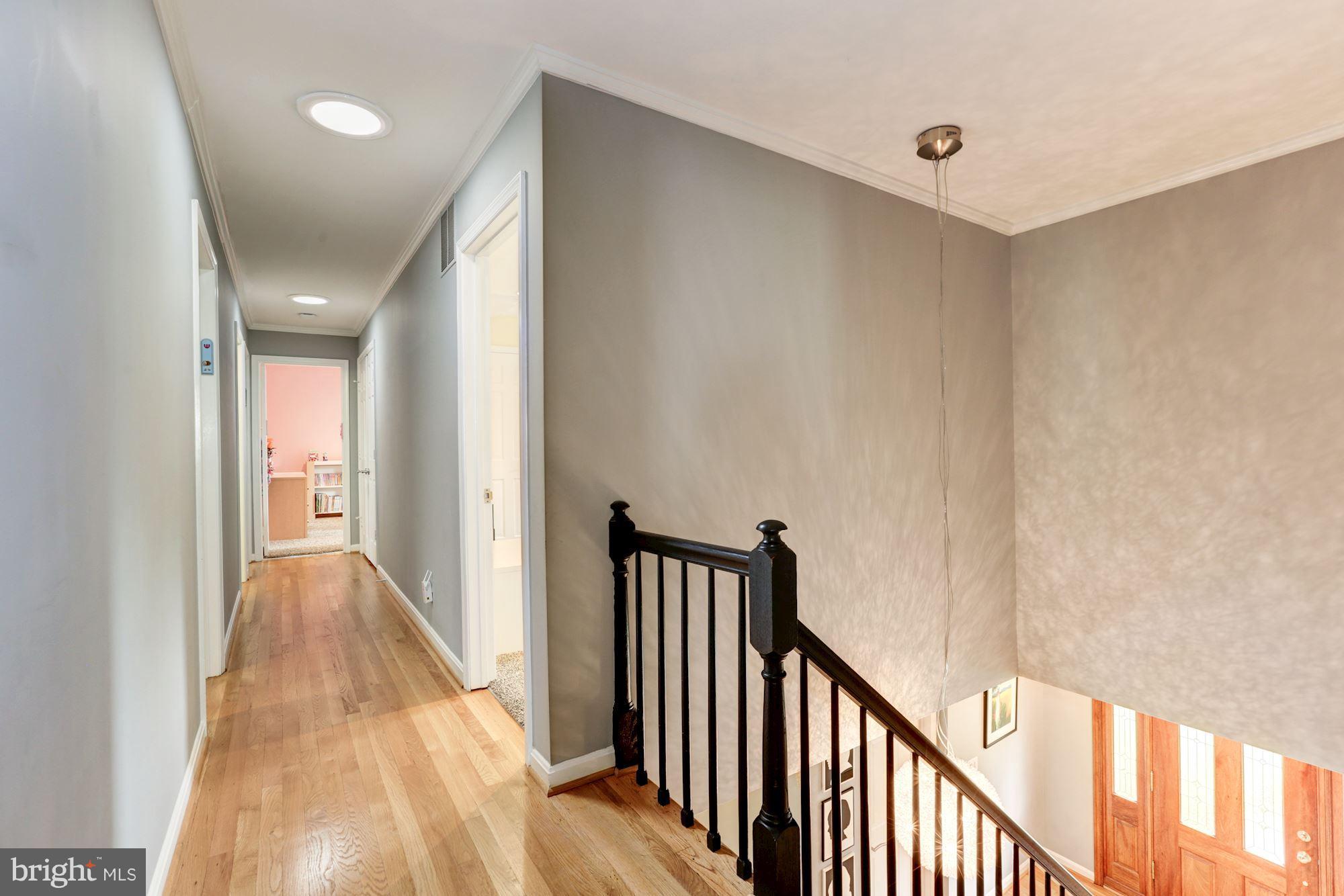 11905 Greenleaf Avenue Potomac, MD 20854 - Photo 22 of 30 Upper level hall with solar tube lighting