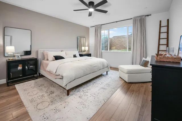 a bedroom with a bed and a couch