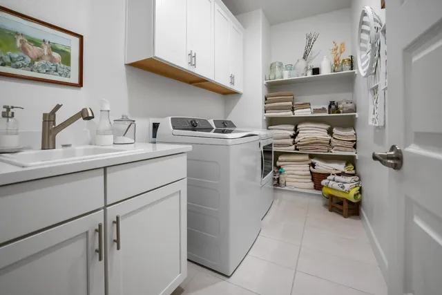 a utility room with cabinets