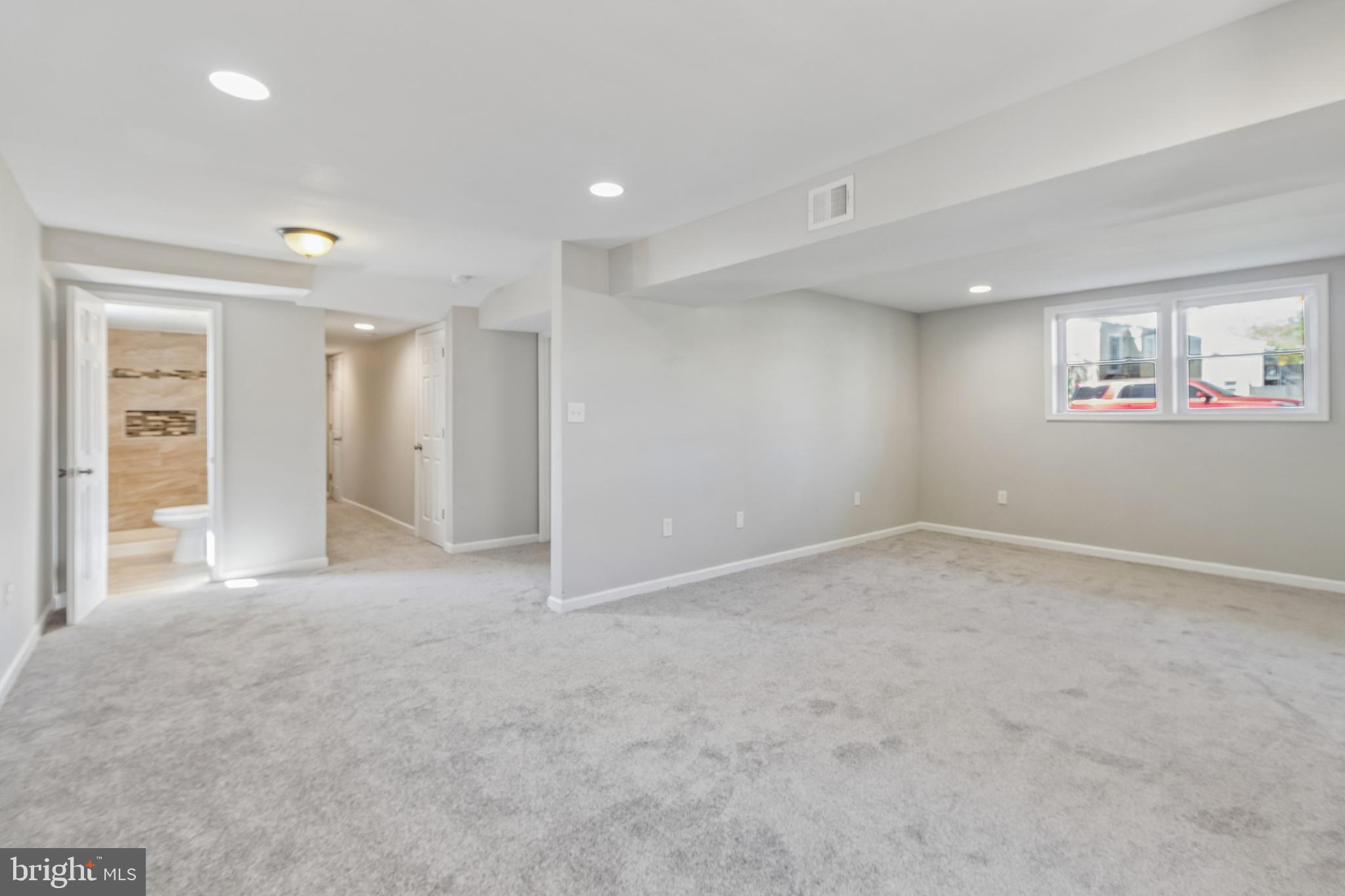 5903 Sylvia Court Clinton, MD 20735 - Photo 11 of 21 an empty room with windows and painted walls
