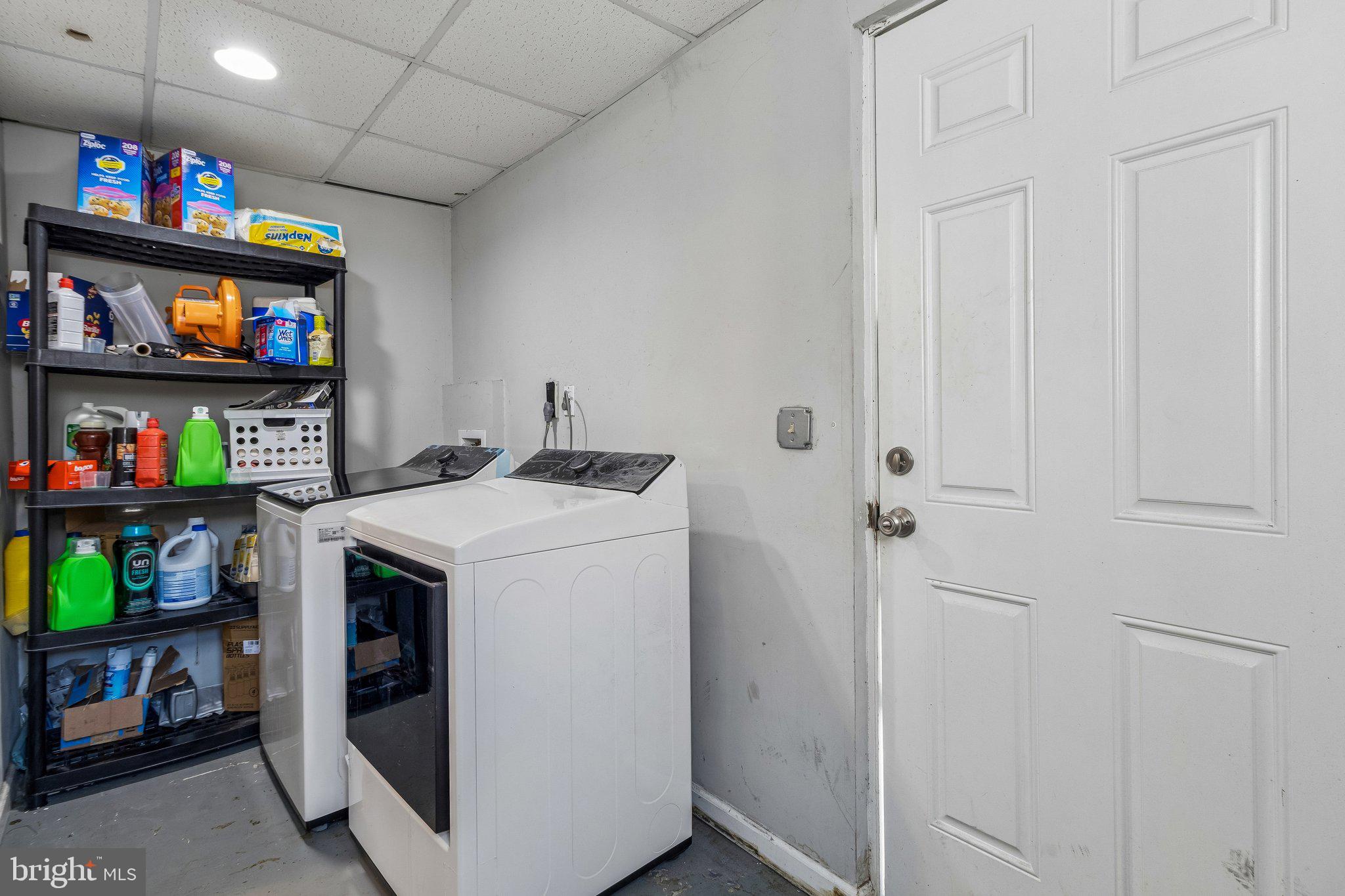5903 Sylvia Court Clinton, MD 20735 - Photo 18 of 21 a utility room with dryer and washer