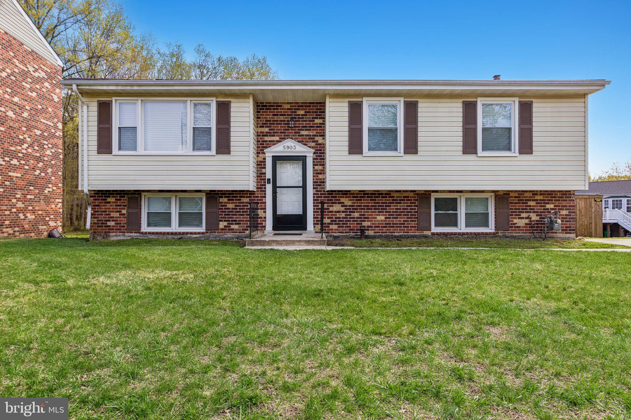 5903 Sylvia Court Clinton, MD 20735 - Photo 3 of 21 front view of a brick house with a yard