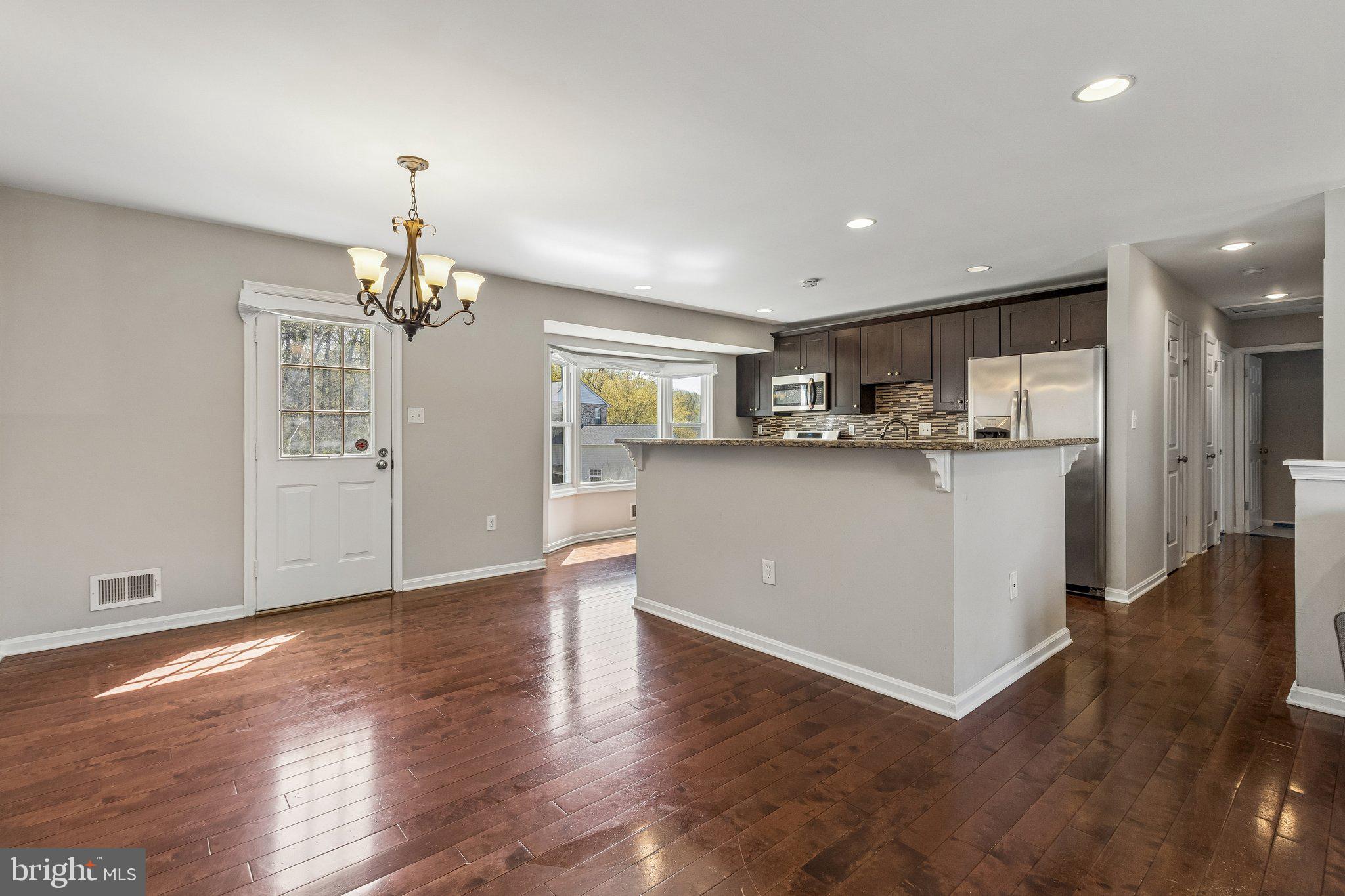 5903 Sylvia Court Clinton, MD 20735 - Photo 5 of 21 a kitchen with stainless steel appliances granite countertop a refrigerator and a stove top oven