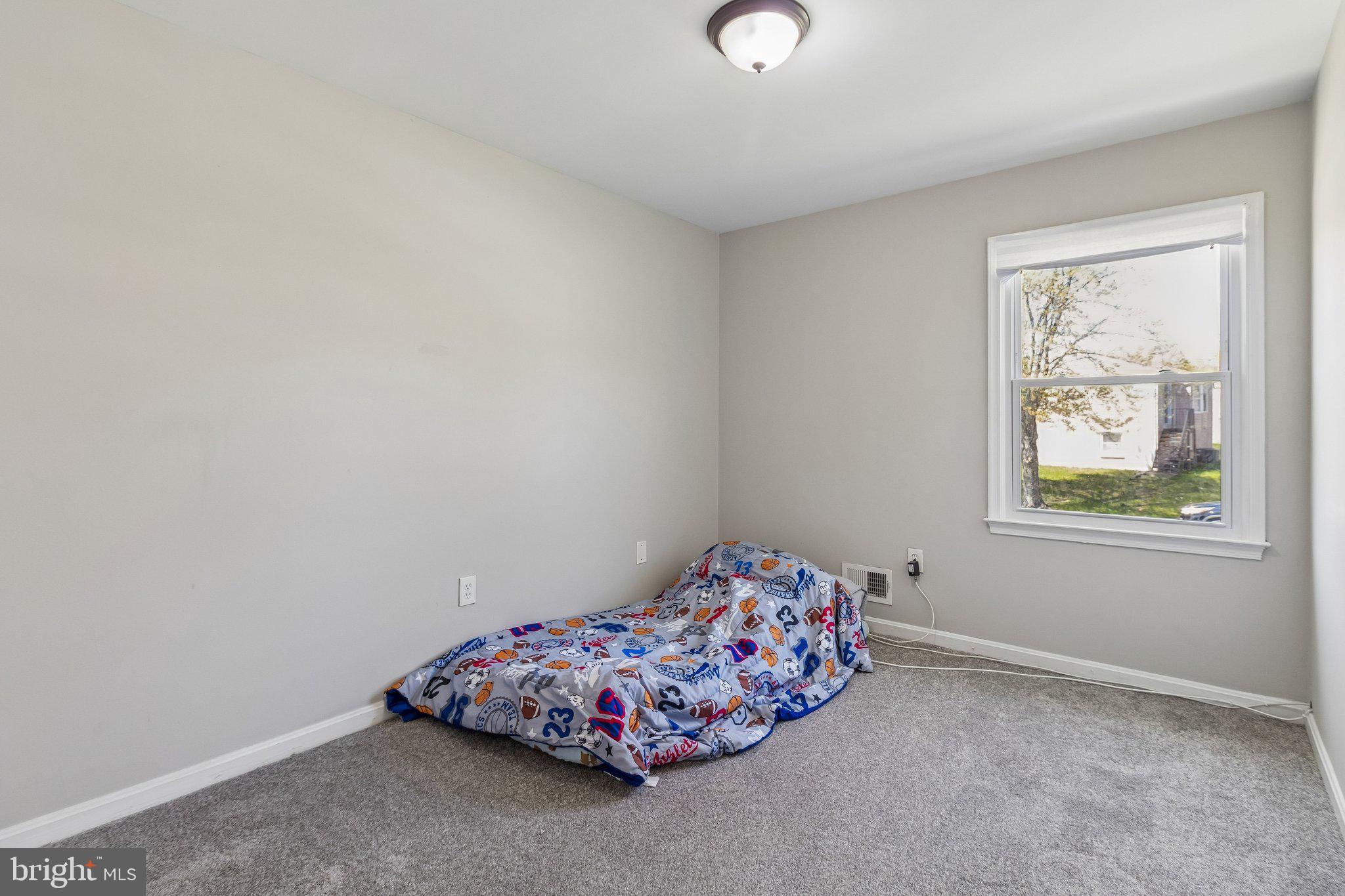 5903 Sylvia Court Clinton, MD 20735 - Photo 8 of 21 a bedroom with a bed and a window
