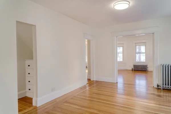 a view of livingroom with hardwood floor and hallway