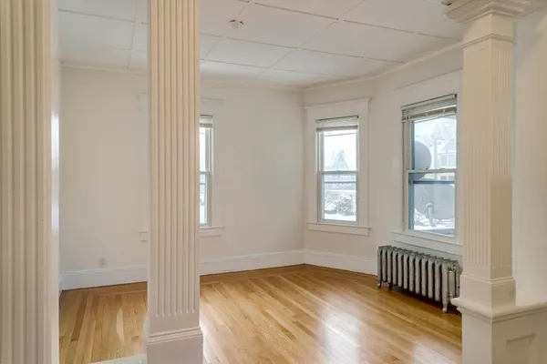 a view of an empty room with glass door