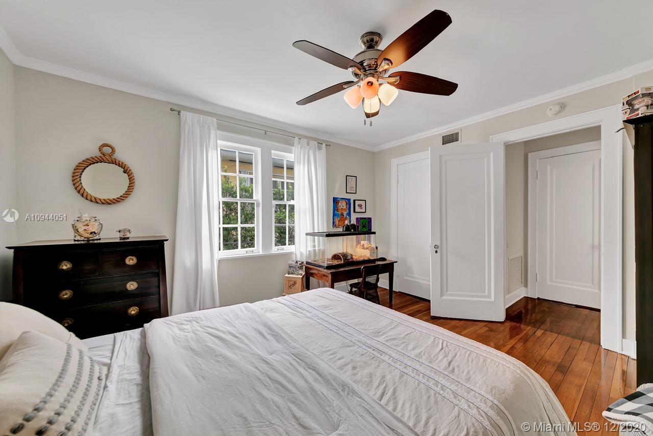 2203 North Bay Road Miami Beach, FL 33140 - Photo 14 of 36 a bedroom with a bed and a window