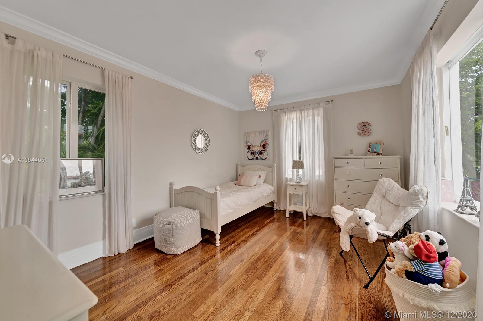 2203 North Bay Road Miami Beach, FL 33140 - Photo 21 of 36 a living room with furniture and wooden floor