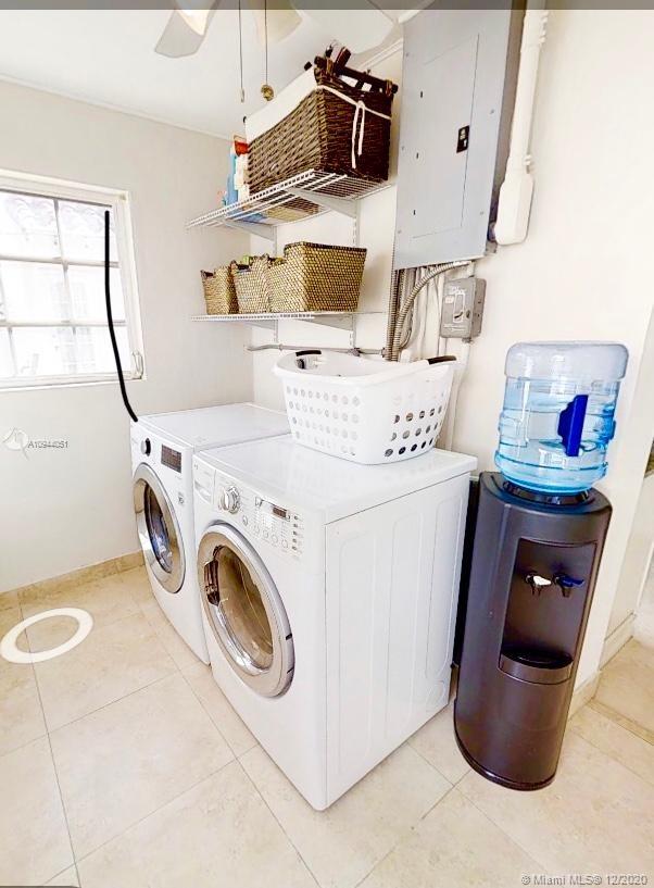 2203 North Bay Road Miami Beach, FL 33140 - Photo 24 of 36 a utility room with dryer and washer
