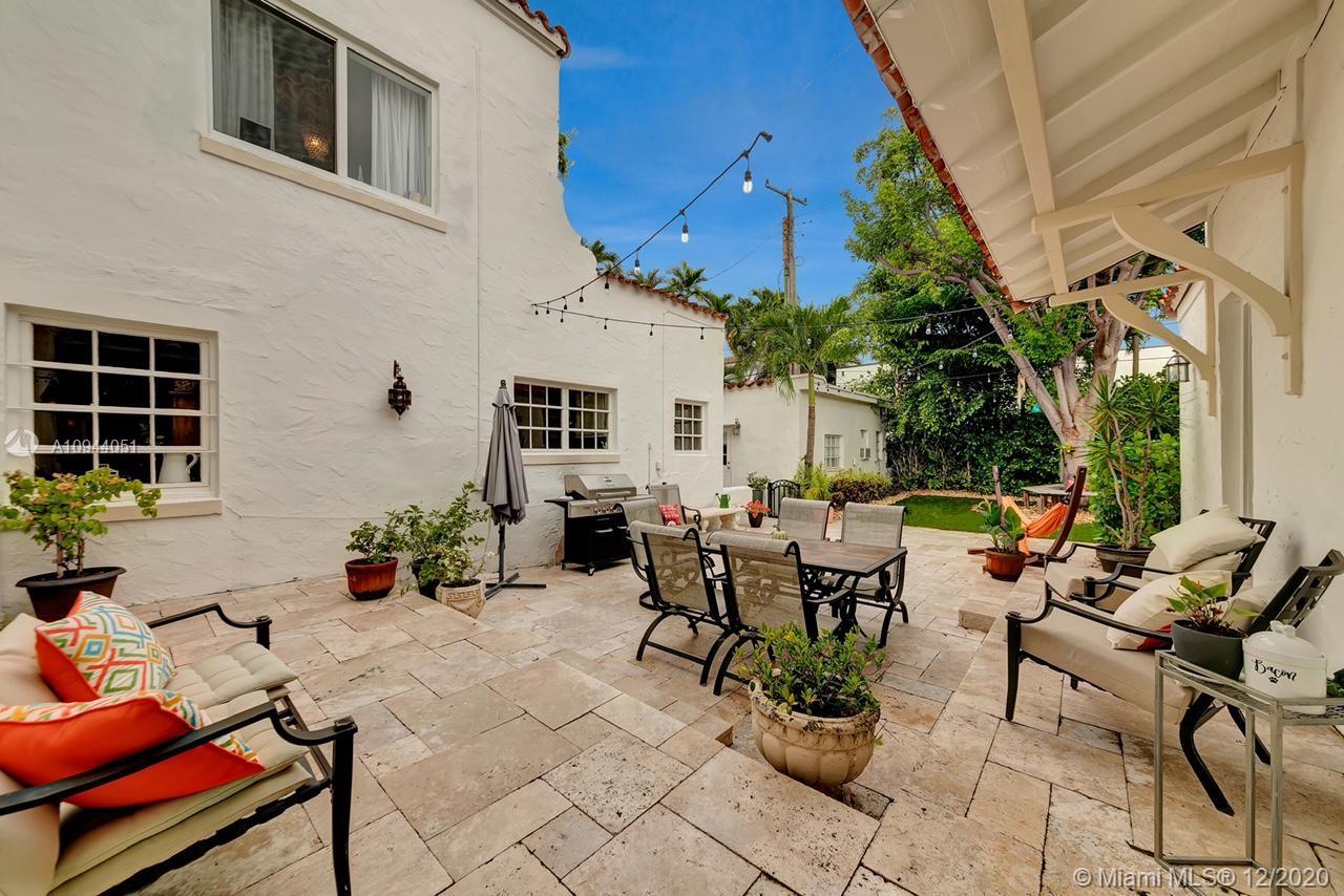 2203 North Bay Road Miami Beach, FL 33140 - Photo 28 of 36 a view of a patio with chairs and potted plants