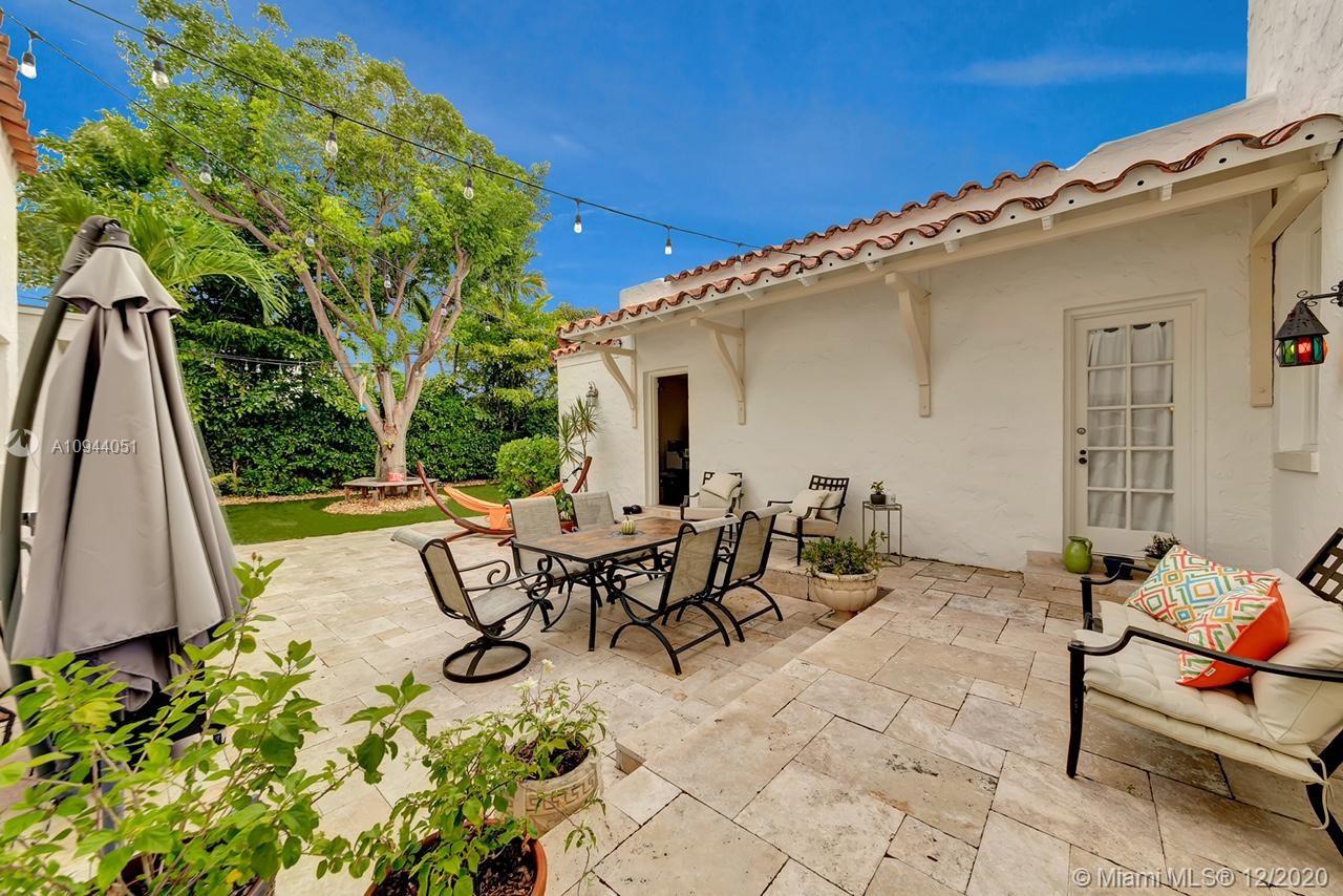 2203 North Bay Road Miami Beach, FL 33140 - Photo 29 of 36 a view of a patio with table and chairs and potted plants