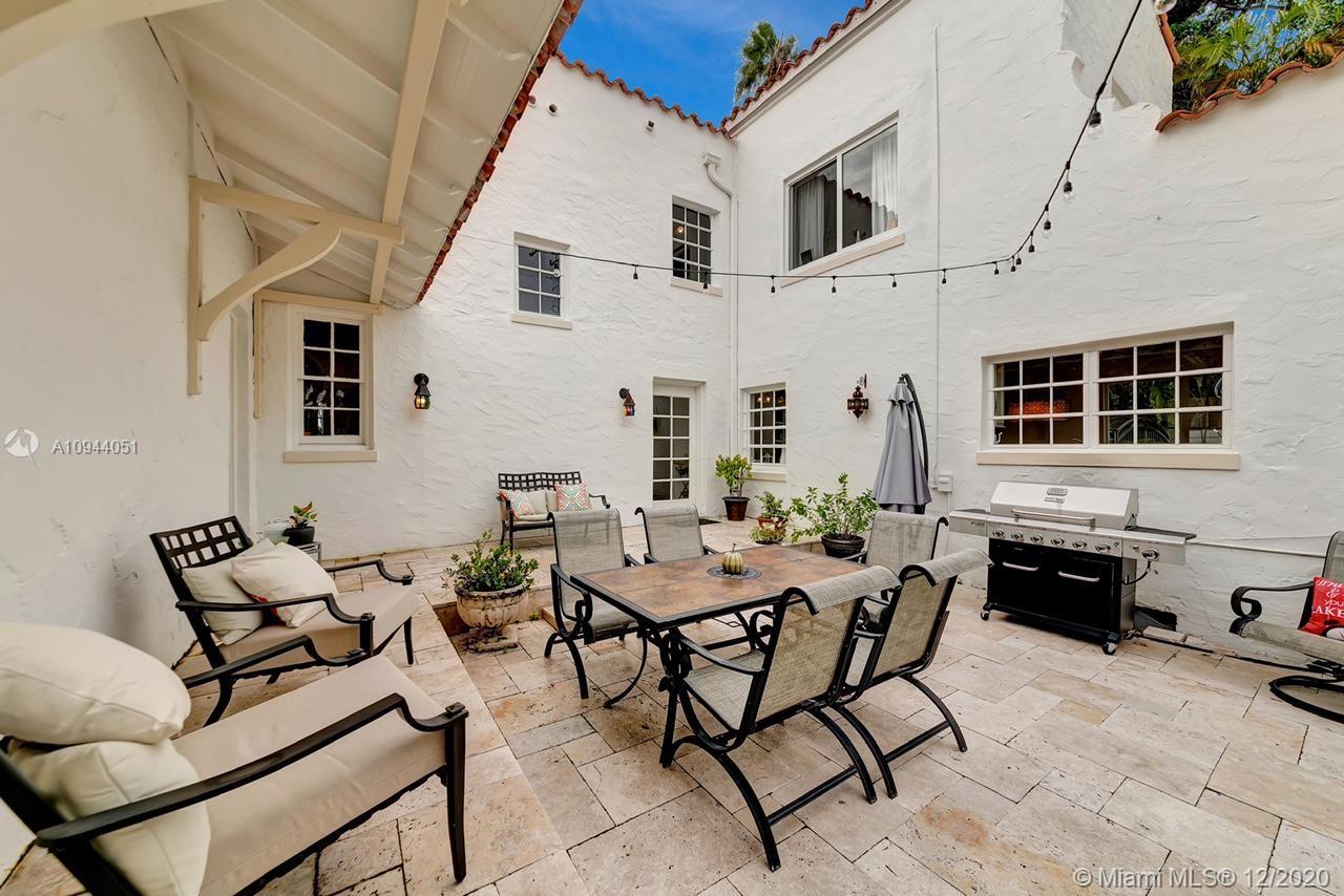 2203 North Bay Road Miami Beach, FL 33140 - Photo 30 of 36 a view of a house with backyard and sitting area