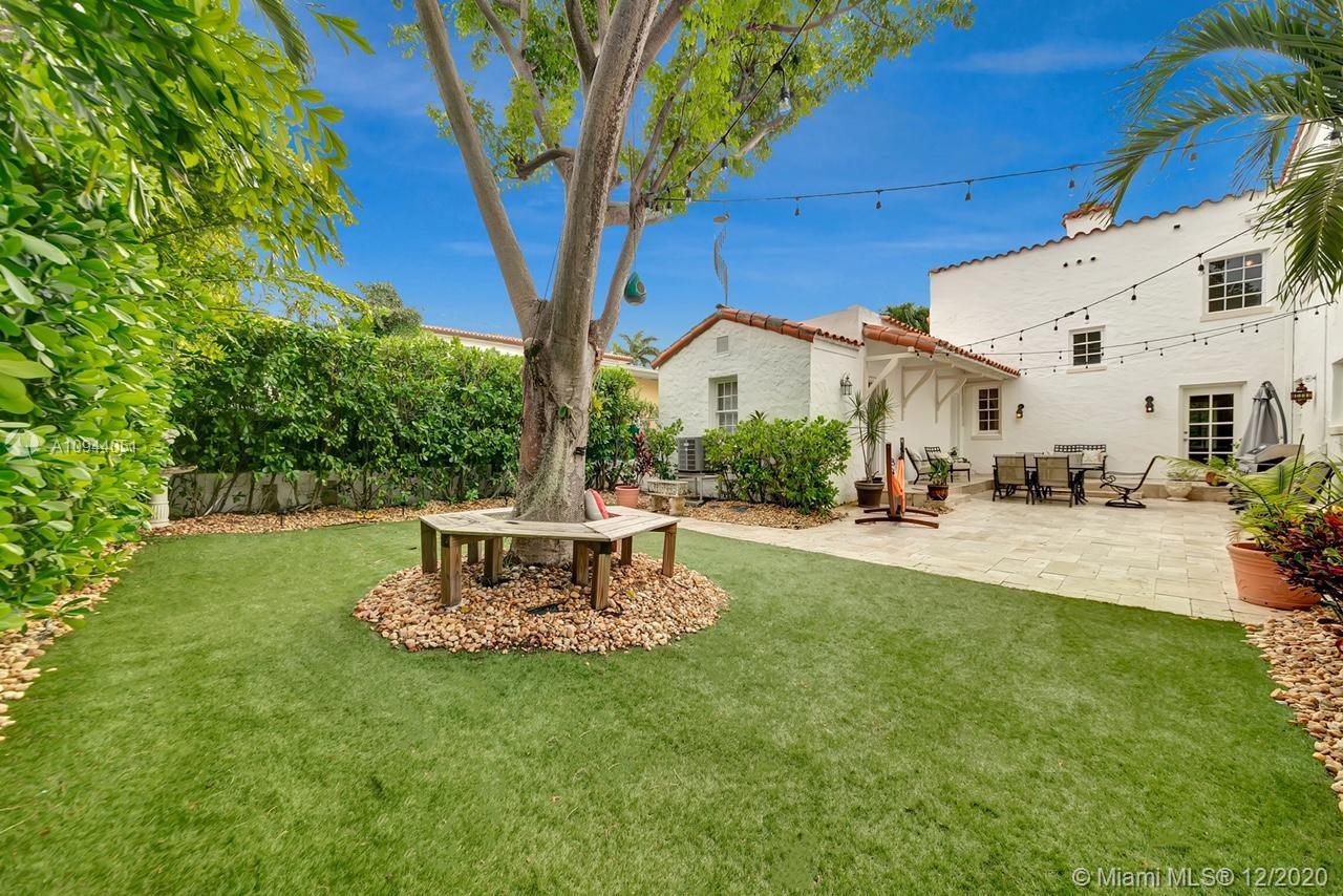 2203 North Bay Road Miami Beach, FL 33140 - Photo 31 of 36 a view of a fountain in the front of a house