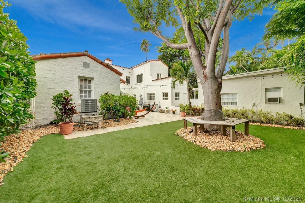 2203 North Bay Road Miami Beach, FL 33140 - Photo 33 of 36 a view of a house with patio and a garden