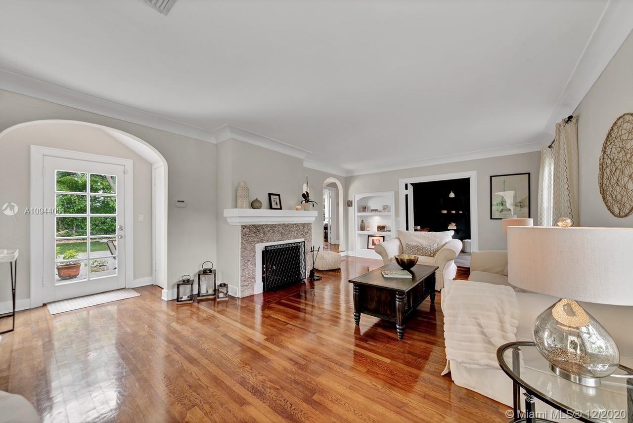 2203 North Bay Road Miami Beach, FL 33140 - Photo 5 of 36 a living room with furniture and a fireplace