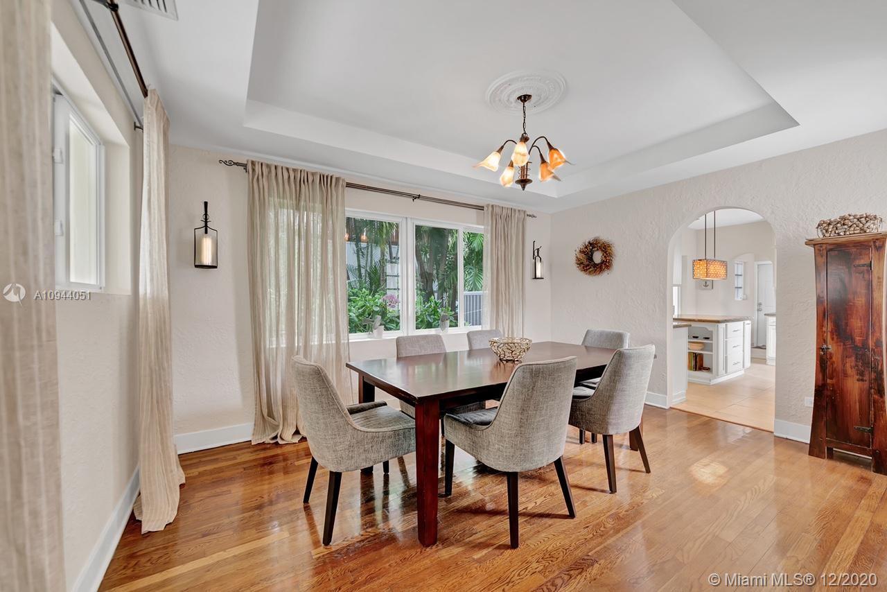 2203 North Bay Road Miami Beach, FL 33140 - Photo 6 of 36 a view of a dining room with furniture window and wooden floor