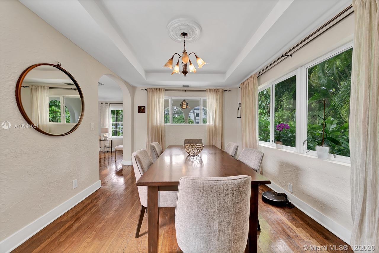 2203 North Bay Road Miami Beach, FL 33140 - Photo 7 of 36 a view of a dining room with furniture window and outside view