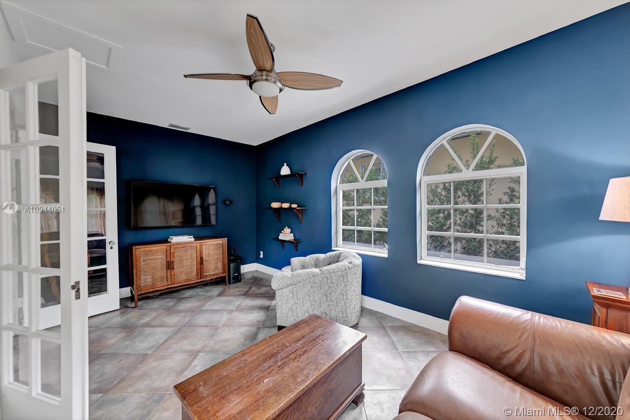 2203 North Bay Road Miami Beach, FL 33140 - Photo 8 of 36 a living room with furniture and a large window