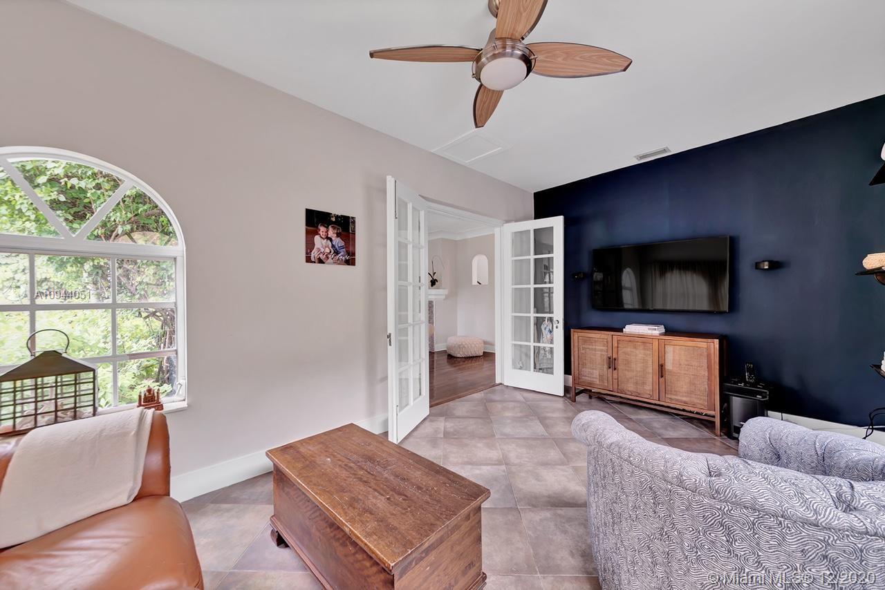 2203 North Bay Road Miami Beach, FL 33140 - Photo 9 of 36 a living room with furniture and a flat screen tv