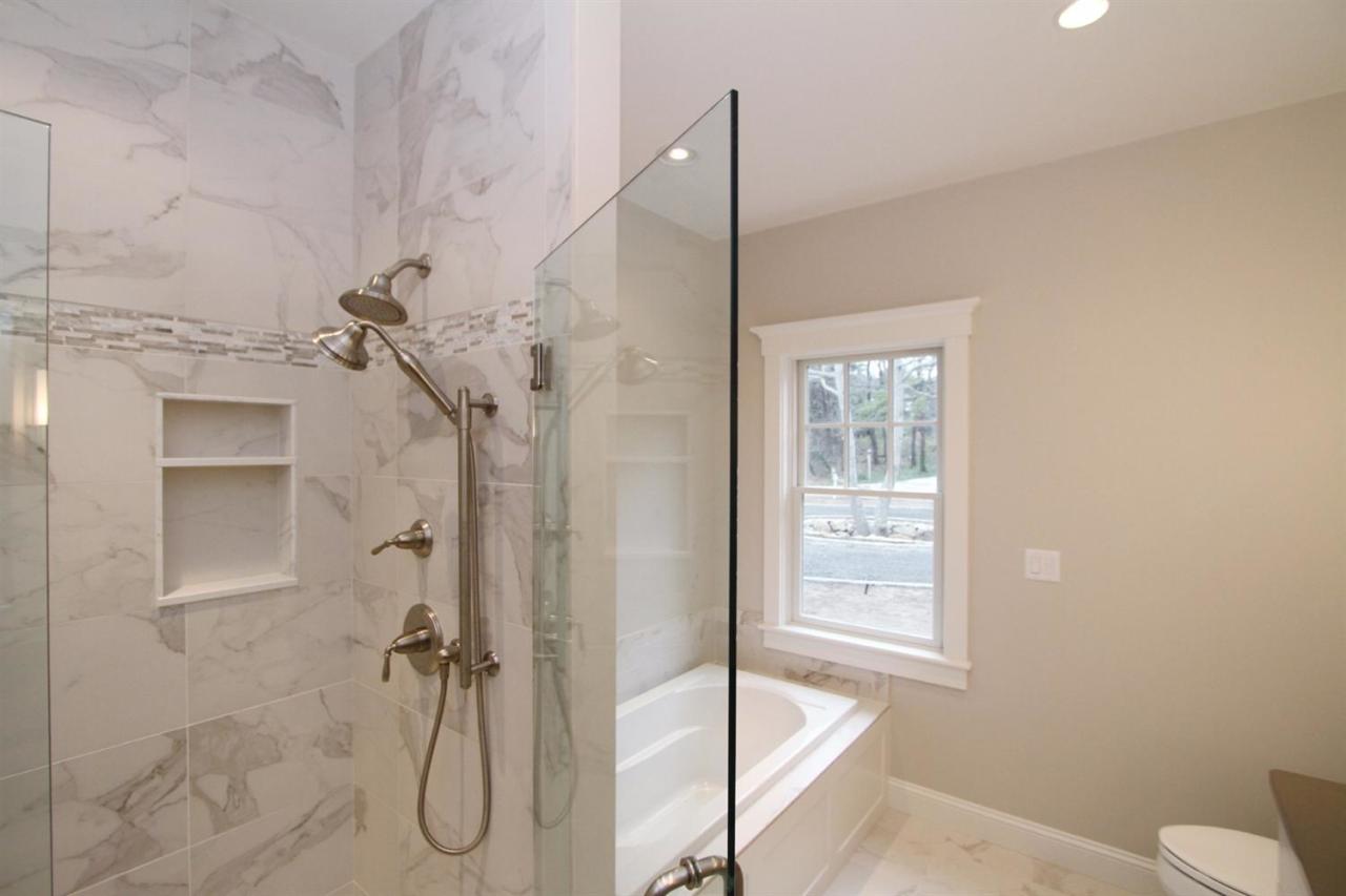 38 Woods Neck Road Orleans, MA 02653 - Photo 17 of 35 a bathroom with a shower and a toilet
