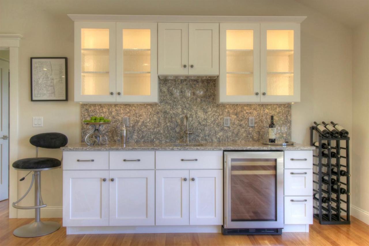 38 Woods Neck Road Orleans, MA 02653 - Photo 19 of 35 a kitchen with white cabinets and window