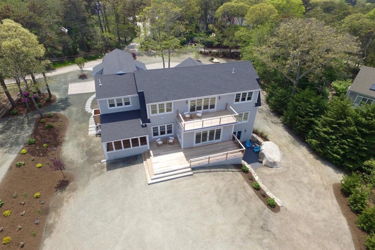 38 Woods Neck Road Orleans, MA 02653 - Photo 21 of 35 an aerial view of residential houses with outdoor space and parking