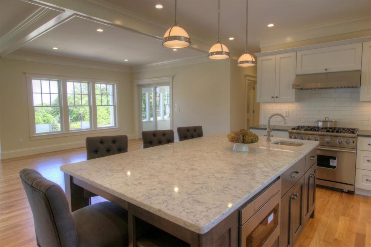 38 Woods Neck Road Orleans, MA 02653 - Photo 24 of 35 a kitchen with a stove and a dining table