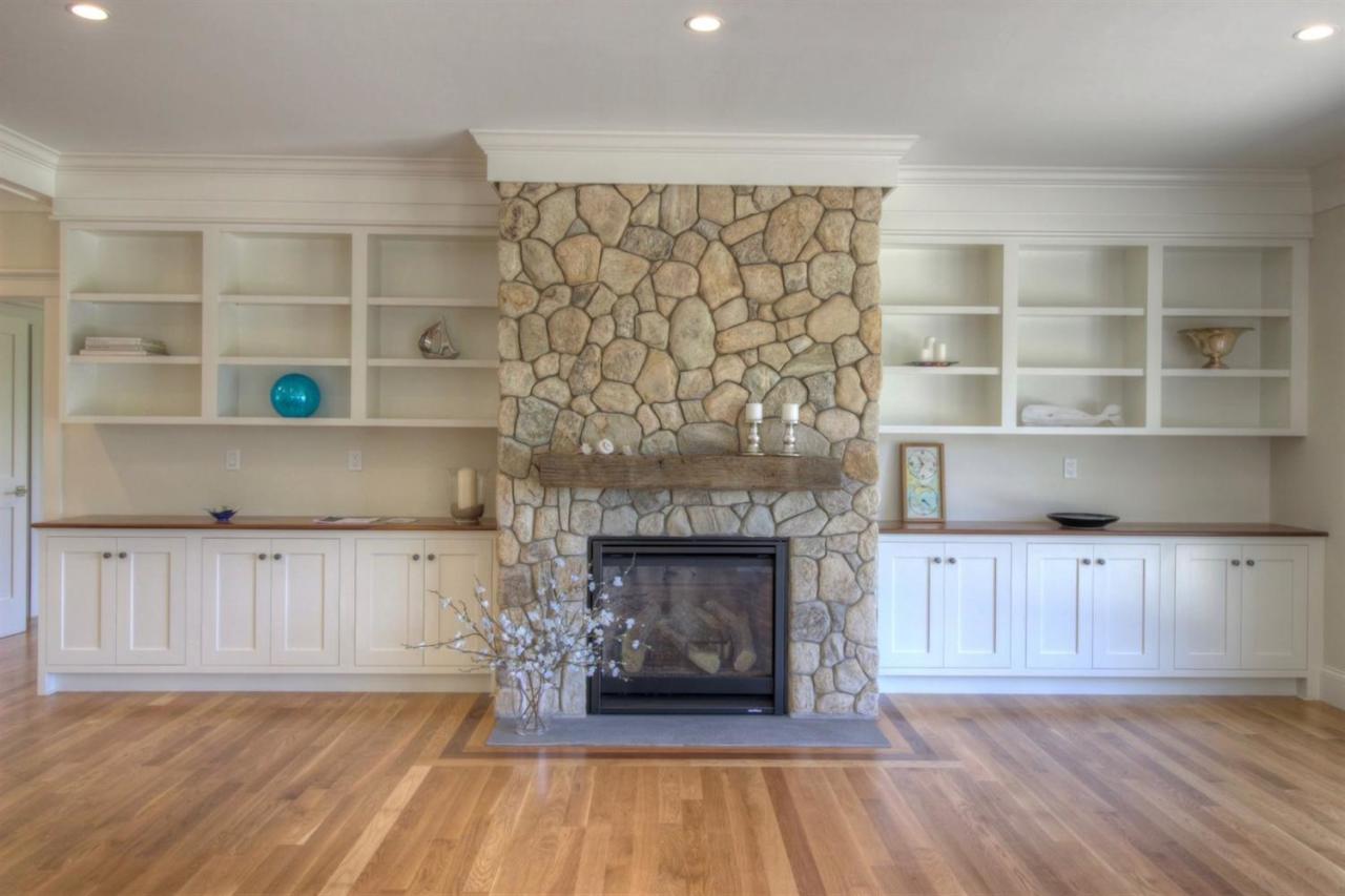 38 Woods Neck Road Orleans, MA 02653 - Photo 27 of 35 a living room with a fireplace