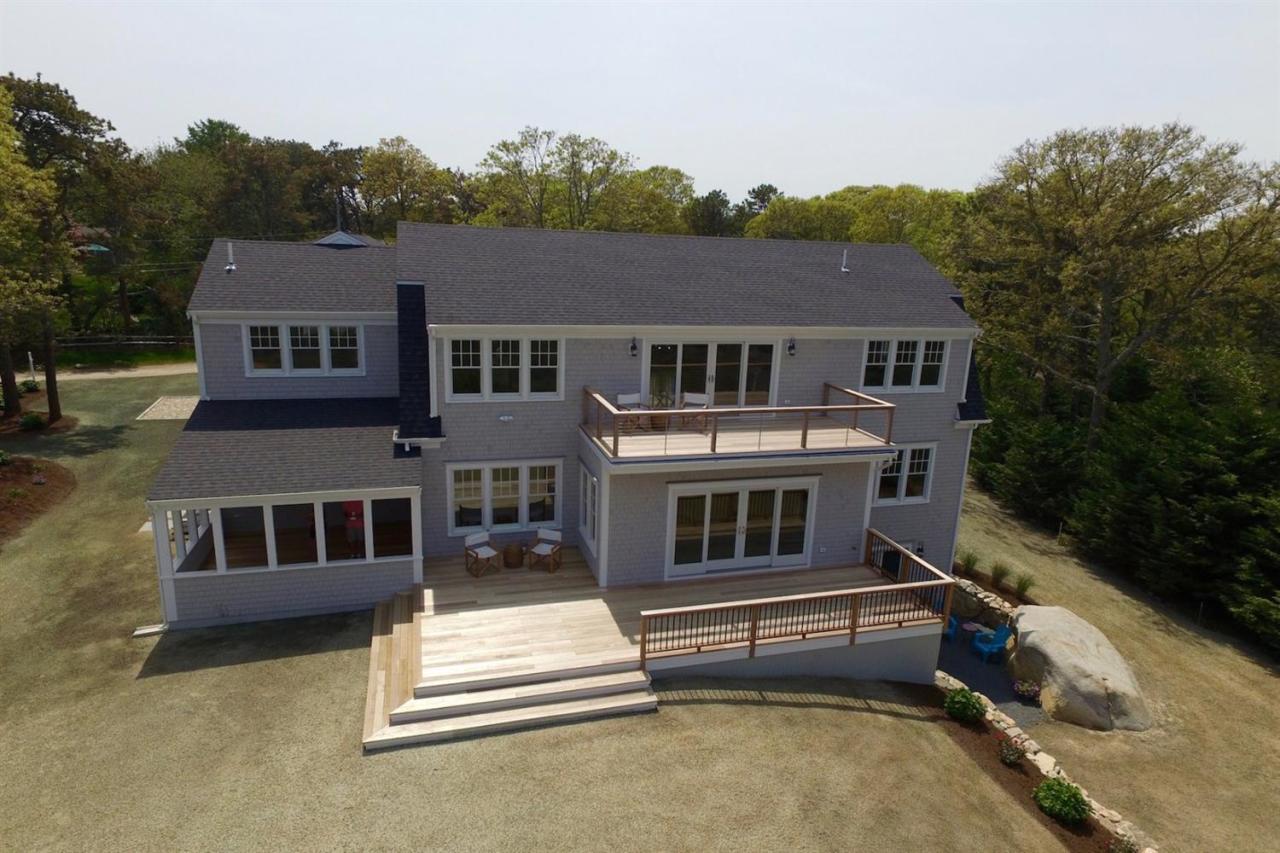 38 Woods Neck Road Orleans, MA 02653 - Photo 3 of 35 a view of a house with a balcony