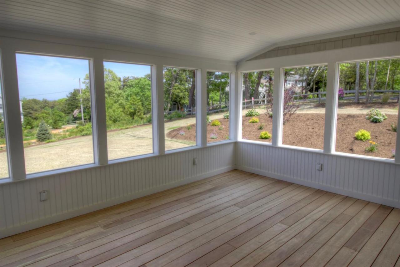 38 Woods Neck Road Orleans, MA 02653 - Photo 31 of 35 a view of an empty room with wooden floor and a window
