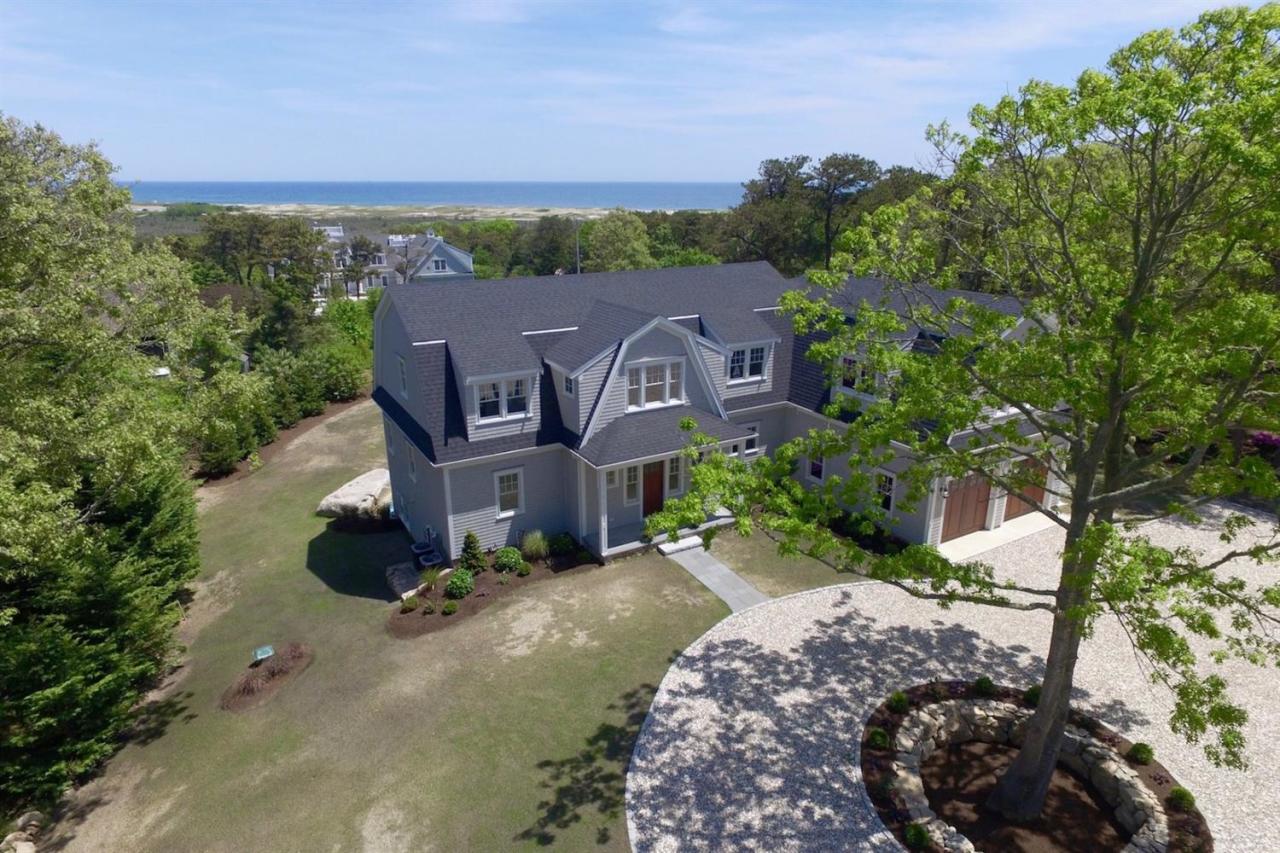 38 Woods Neck Road Orleans, MA 02653 - Photo 34 of 35 an aerial view of a house with a garden