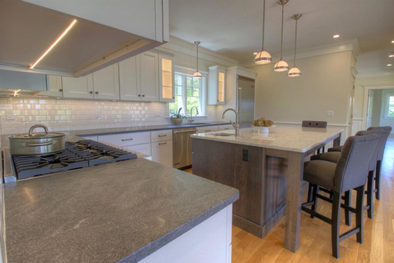 38 Woods Neck Road Orleans, MA 02653 - Photo 6 of 35 a kitchen with a sink a stove a refrigerator and a dining table with wooden floor