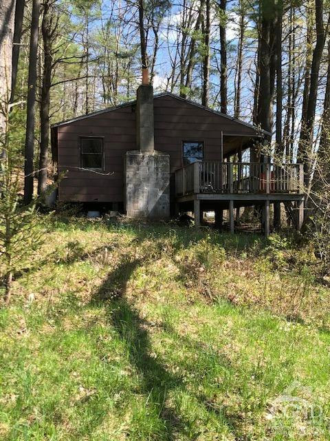 510 Mill Valley Road Middleburgh, NY 12122 - Photo 33 of 50 a backyard of a house with barbeque oven and outdoor seating