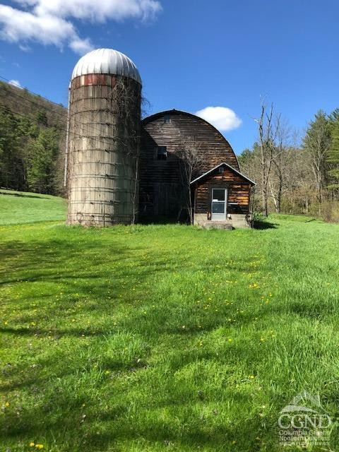 510 Mill Valley Road Middleburgh, NY 12122 - Photo 46 of 50 a view of a house with a yard