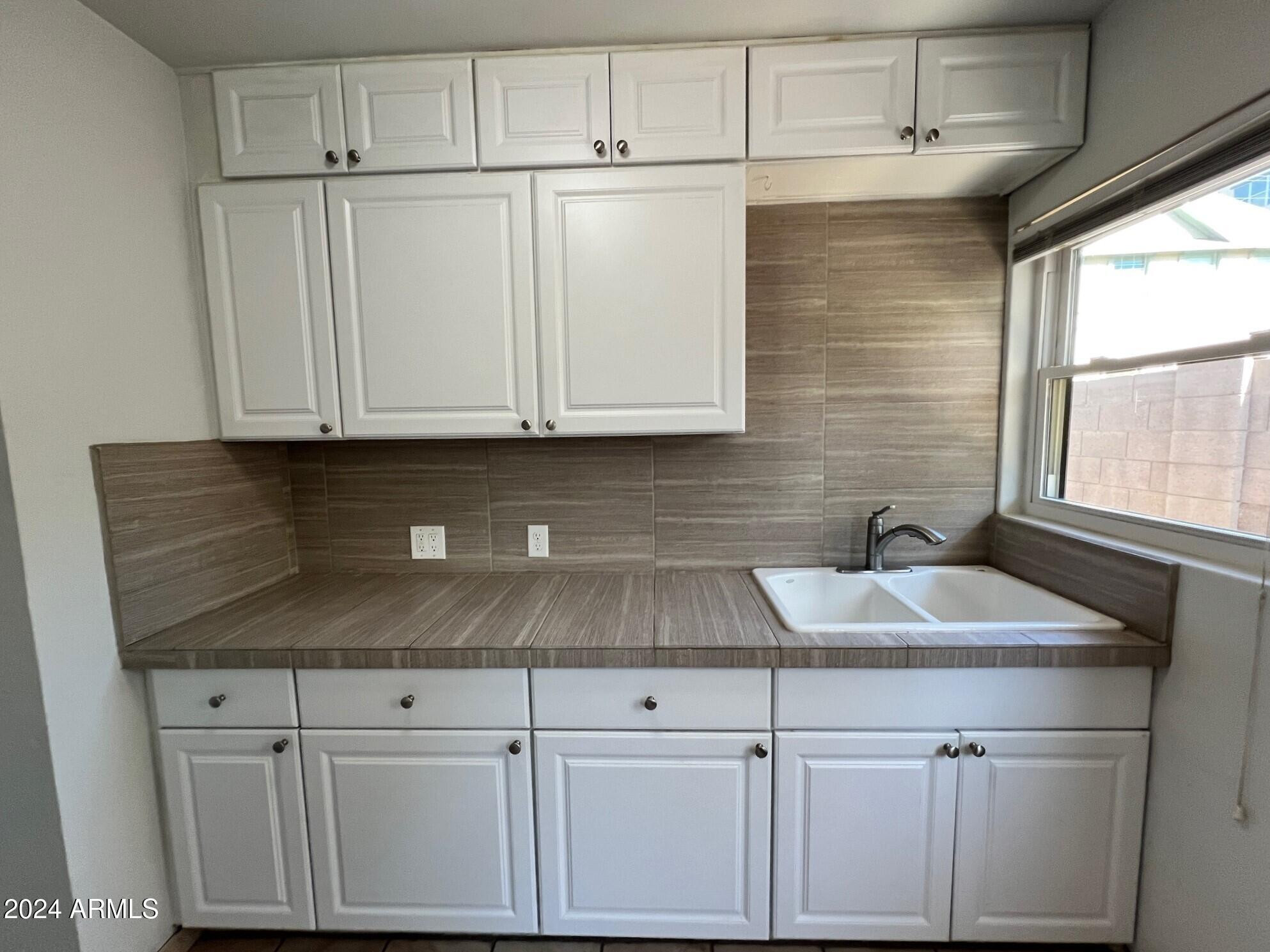 30 West Culver Street, Unit B Phoenix, AZ 85003 - Photo 15 of 36 a sink with white cabinets