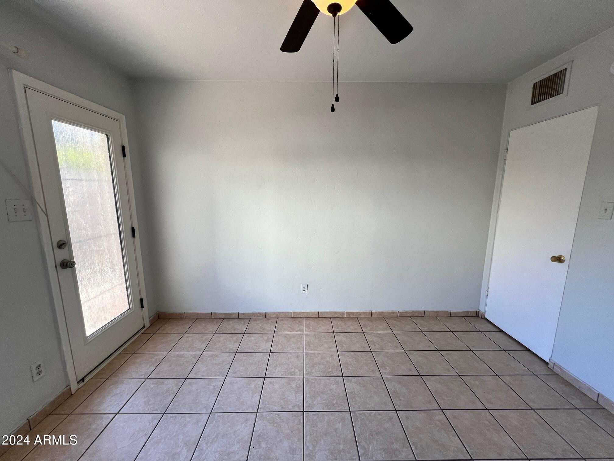 30 West Culver Street, Unit B Phoenix, AZ 85003 - Photo 22 of 36 an empty room with white walls and windows