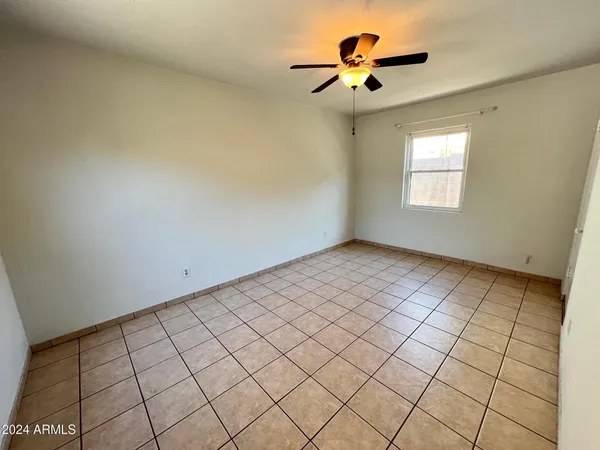 a view of an empty room and window