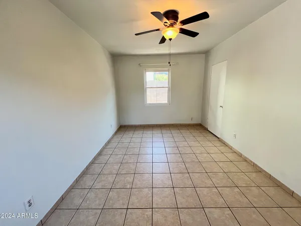 a view of an empty room and window