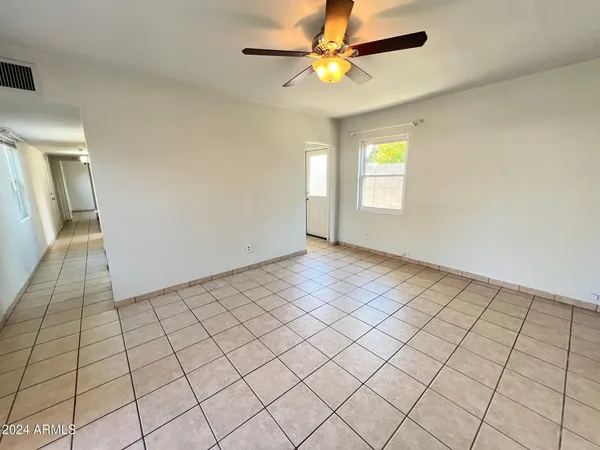 a view of an empty room and window