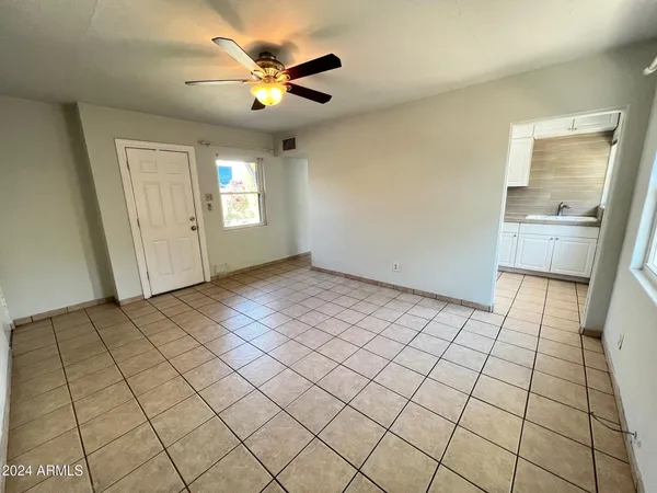 a view of an empty room and window