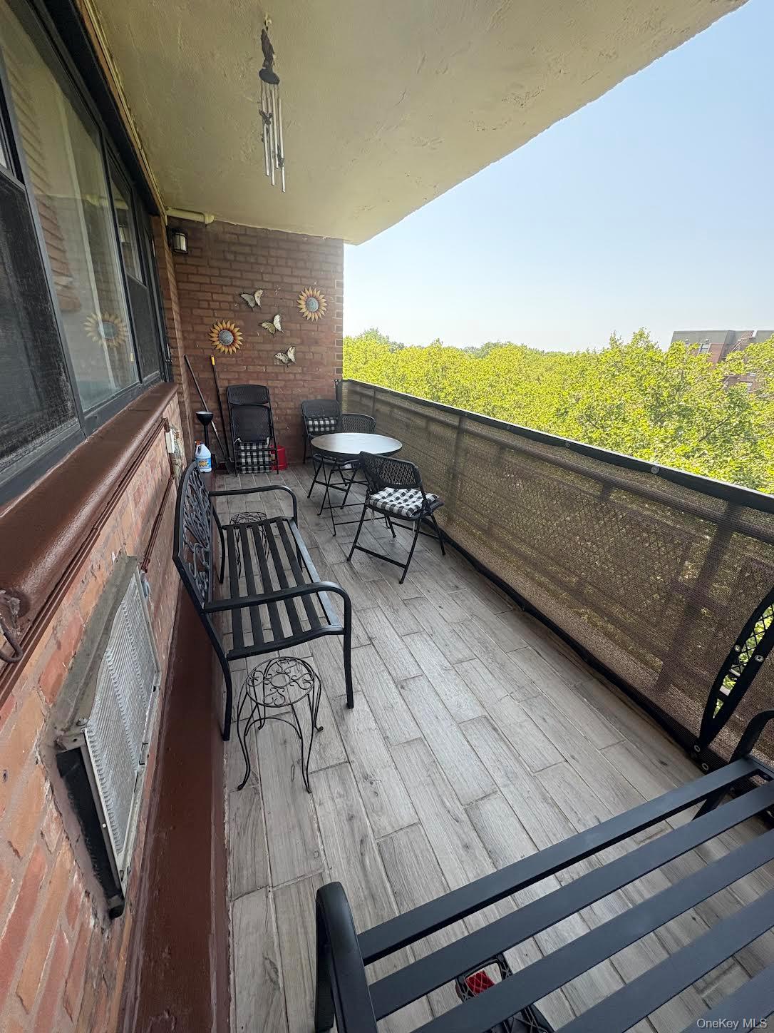 a view of a balcony with chairs