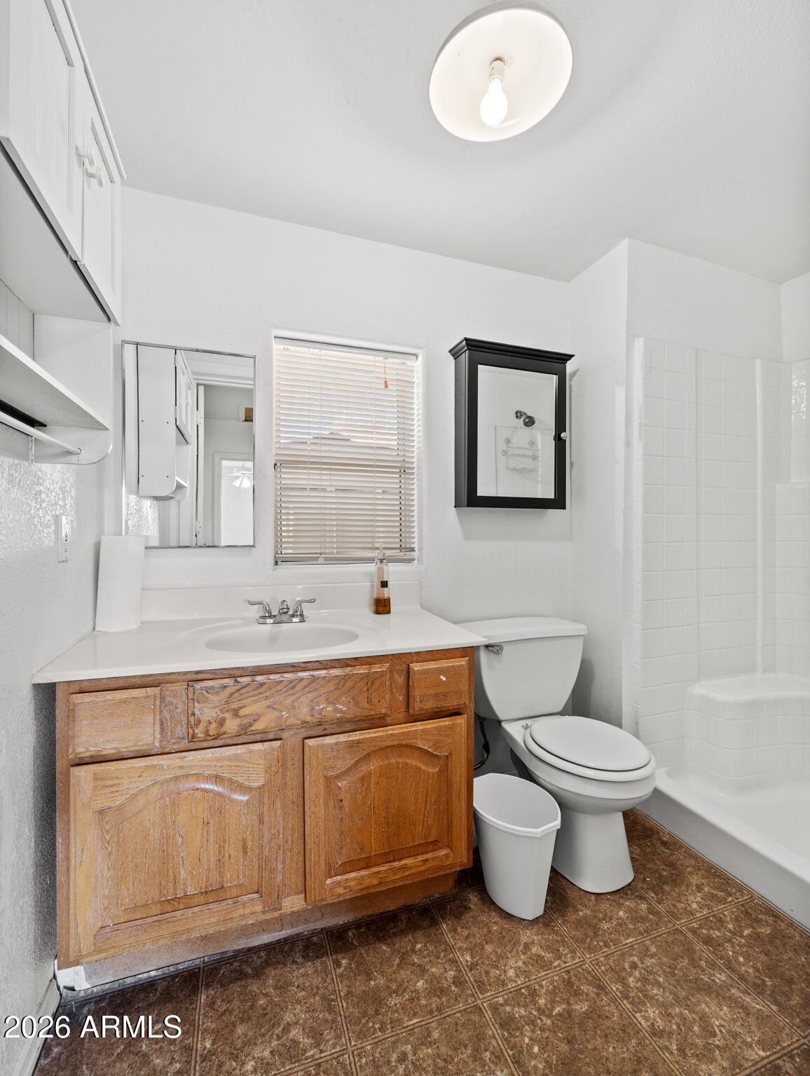 18420 Peeples Valley Road Peeples Valley, AZ 86332 - Photo 21 of 31 a bathroom with a toilet sink and mirror