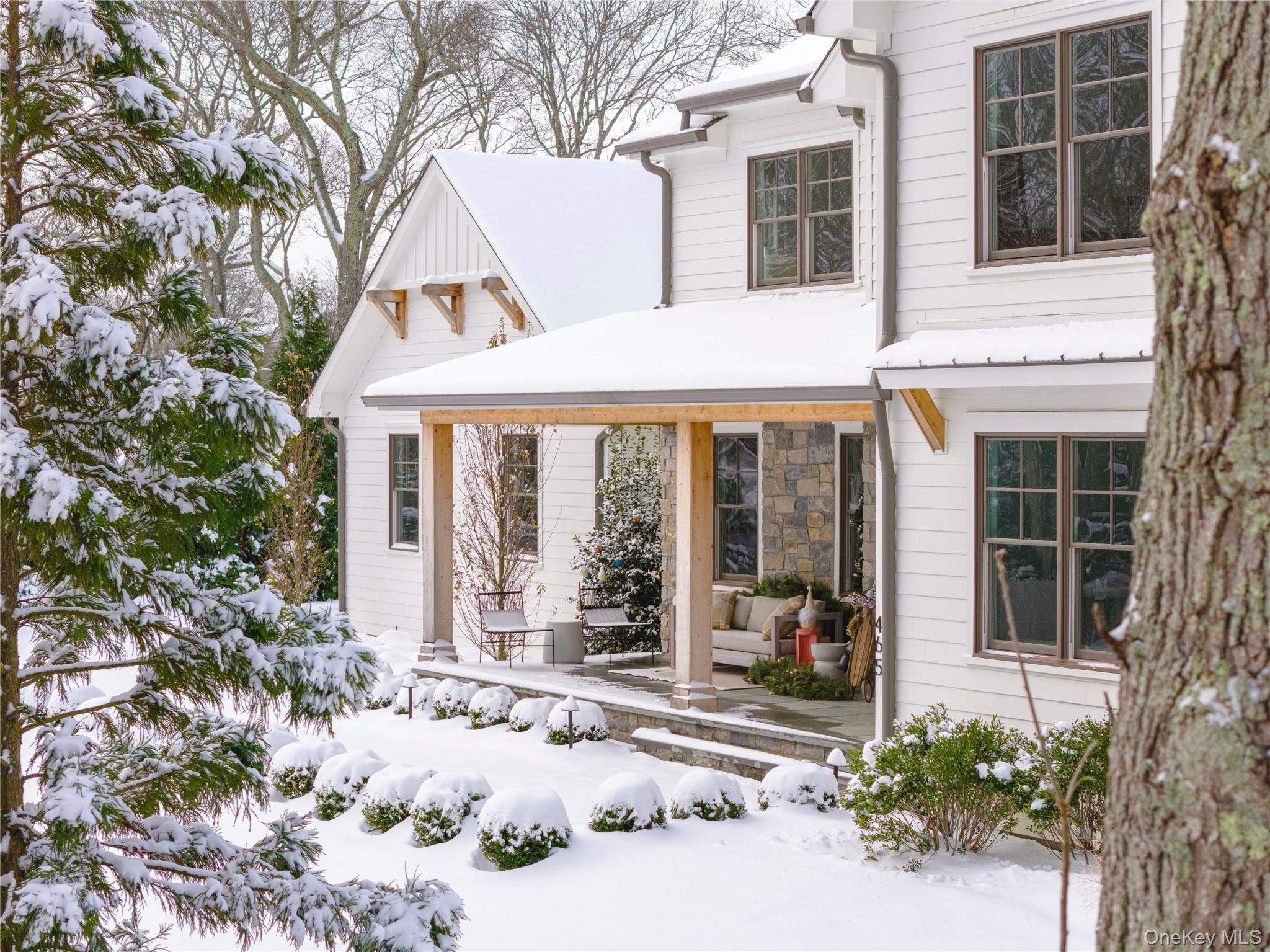 a front view of a house with a yard outdoor seating and barbeque oven