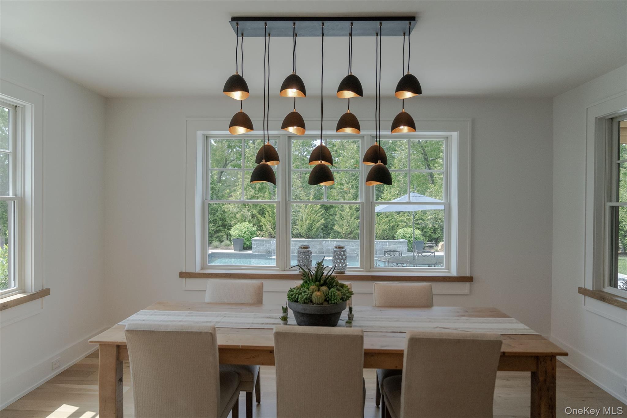 465 Ripple Water Lane Southold, NY 11971 - Photo 21 of 47 Dining area with plenty of natural light and light wood finished floors