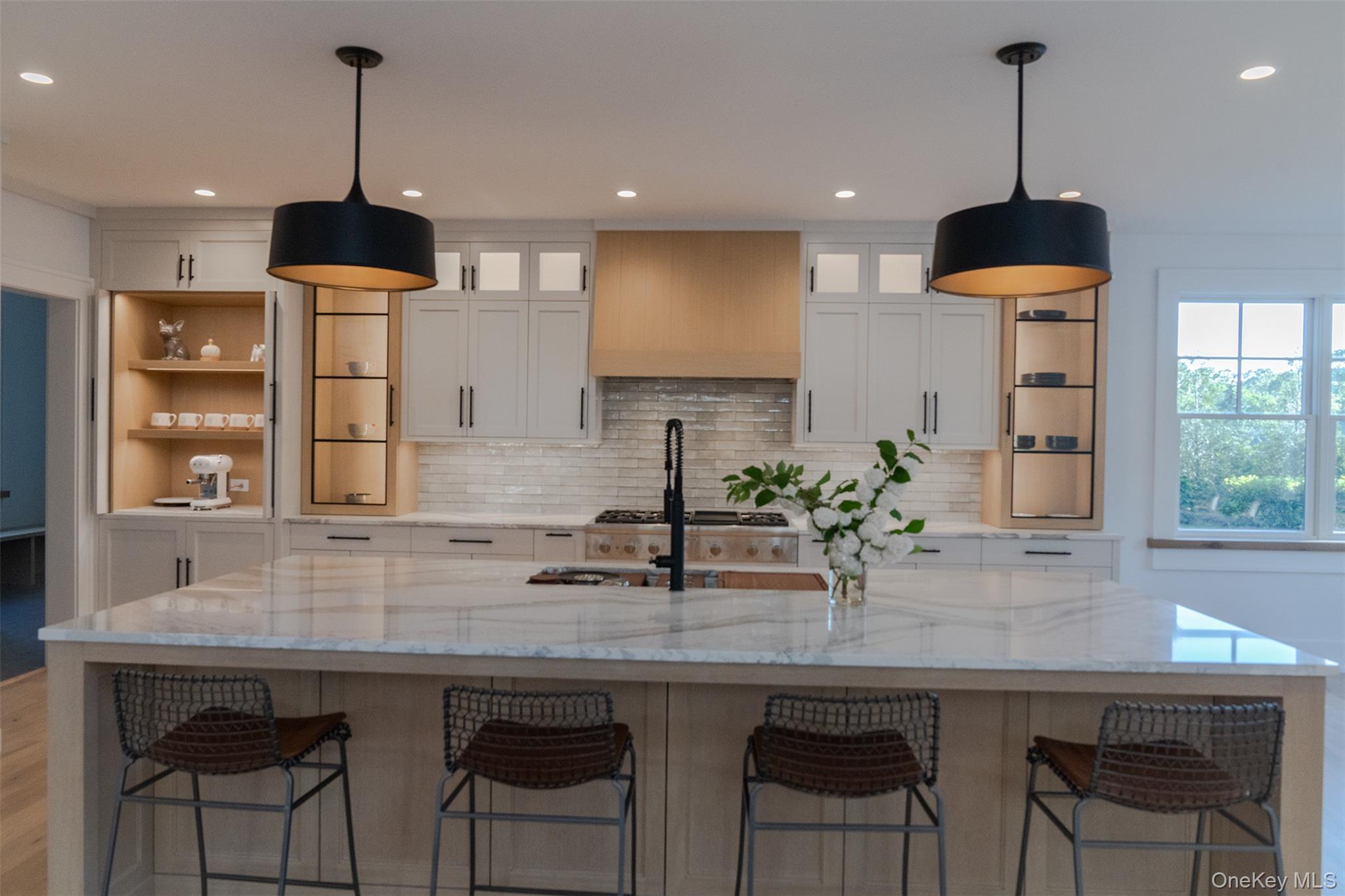 465 Ripple Water Lane Southold, NY 11971 - Photo 22 of 47 Kitchen with white cabinetry, light stone counters, and recessed lighting